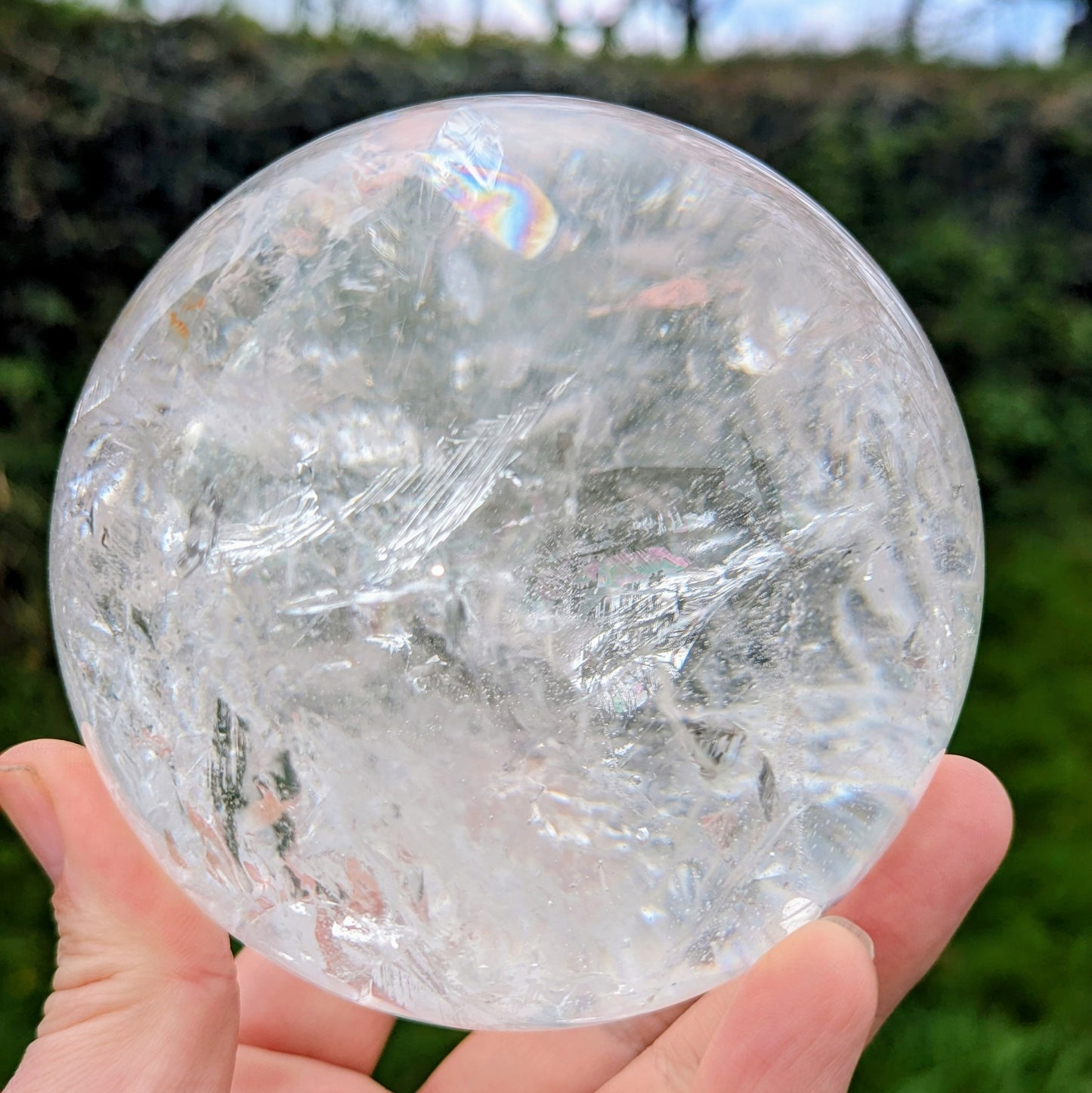 High Quality very clear Quartz Sphere with rainbows and interesting inclusion