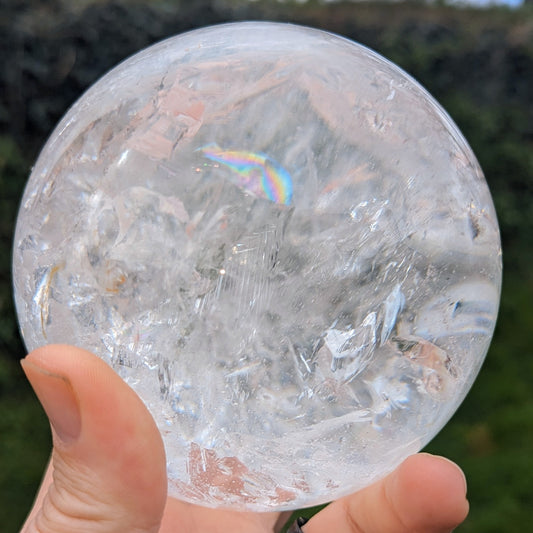 High Quality very clear Quartz Sphere with rainbows and interesting inclusion