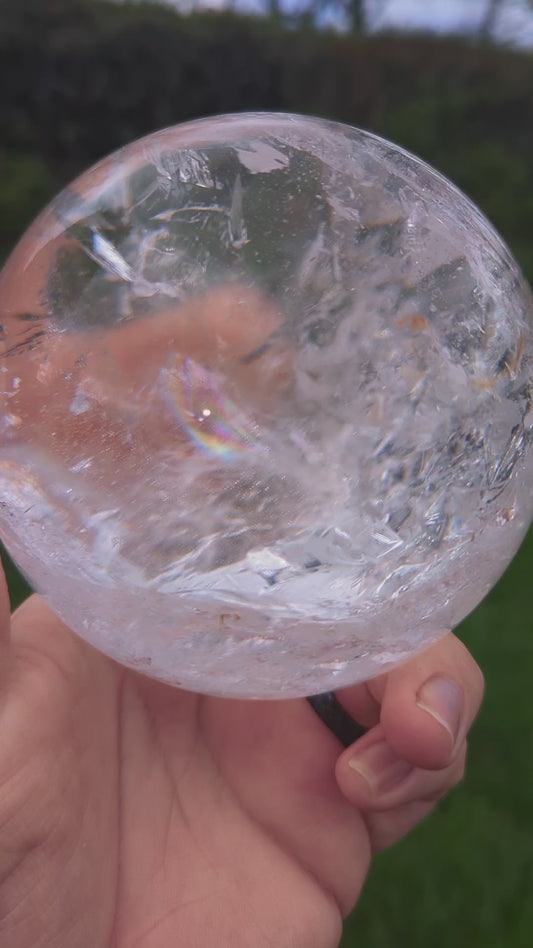 High Quality very clear Quartz Sphere with rainbows and interesting inclusion